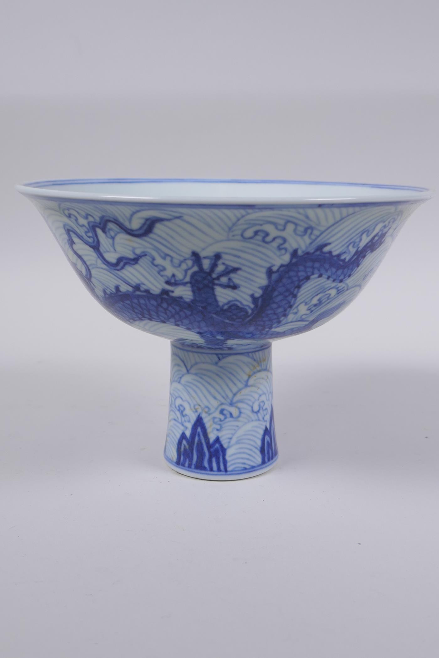 A blue and white porcelain stem bowl with dragon decoration, Chinese Xuande 6 character mark to - Image 3 of 6