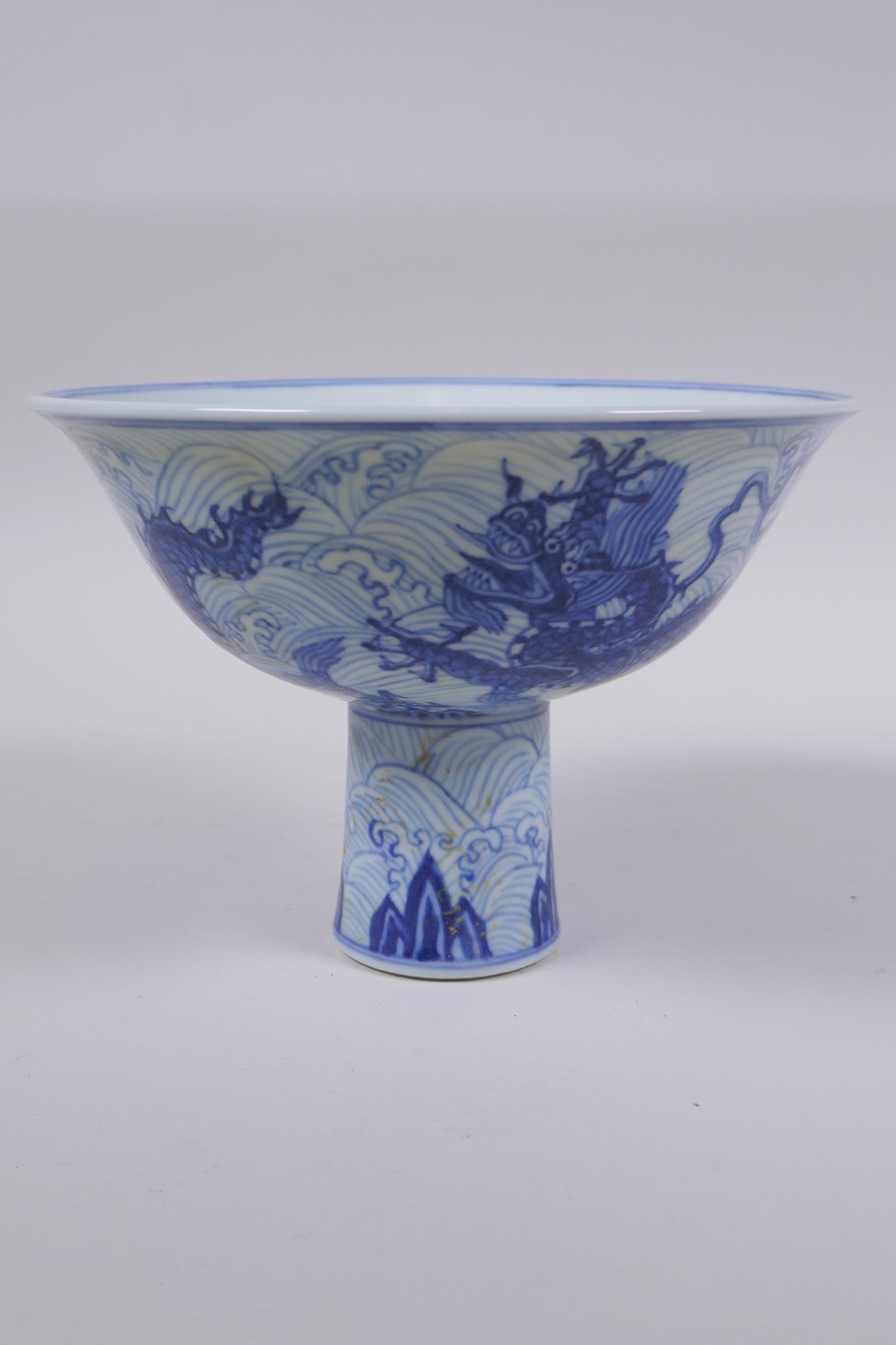 A blue and white porcelain stem bowl with dragon decoration, Chinese Xuande 6 character mark to - Image 4 of 6