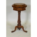 A William IV pollard oak tea poy, the lift up top revealing a fitted interior of a pair of lidded