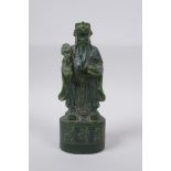 A Chinese green hardstone carving of the deity Lu, 20cm high