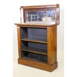 A C19th rosewood open bookcase, with mirror back and upper shelf with gallery, raised on a plinth