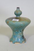 A studio pottery vase of waisted form and spatter blue glaze, 22cm high