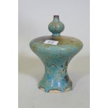 A studio pottery vase of waisted form and spatter blue glaze, 22cm high