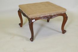 A Victorian carved walnut stool, raised on cabriole supports, 60 x 60 x 40cm