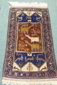 A Middle Eastern wool carpet with blue borders and terracotta field decorated with birds and beasts,