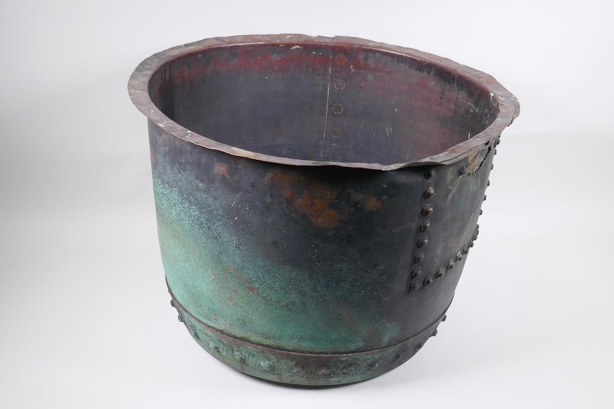 An antique riveted copper bin, with historic repair, 36cm high, 50cm diameter - Image 3 of 5