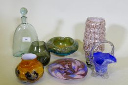 A collection of studio glass, decanters and bowls and a Caithness Cadenza hearts vase, decanter 25cm