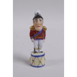 A C19th porcelain pipe stopper/tamper in the form of Arthur Wellesley, 1st Duke of Wellington, AF