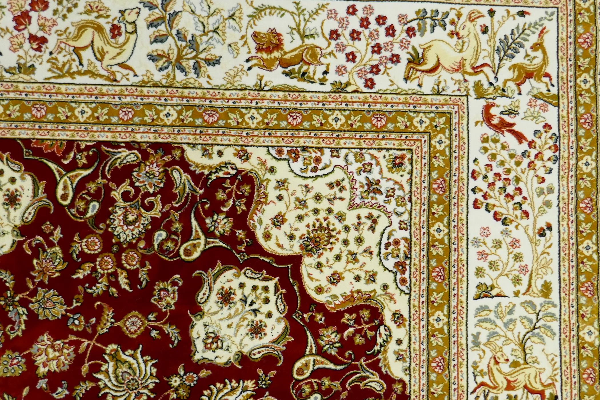 A Persian red ground full pile bamboo silk carpet with central floral medallion design and cream - Image 5 of 9