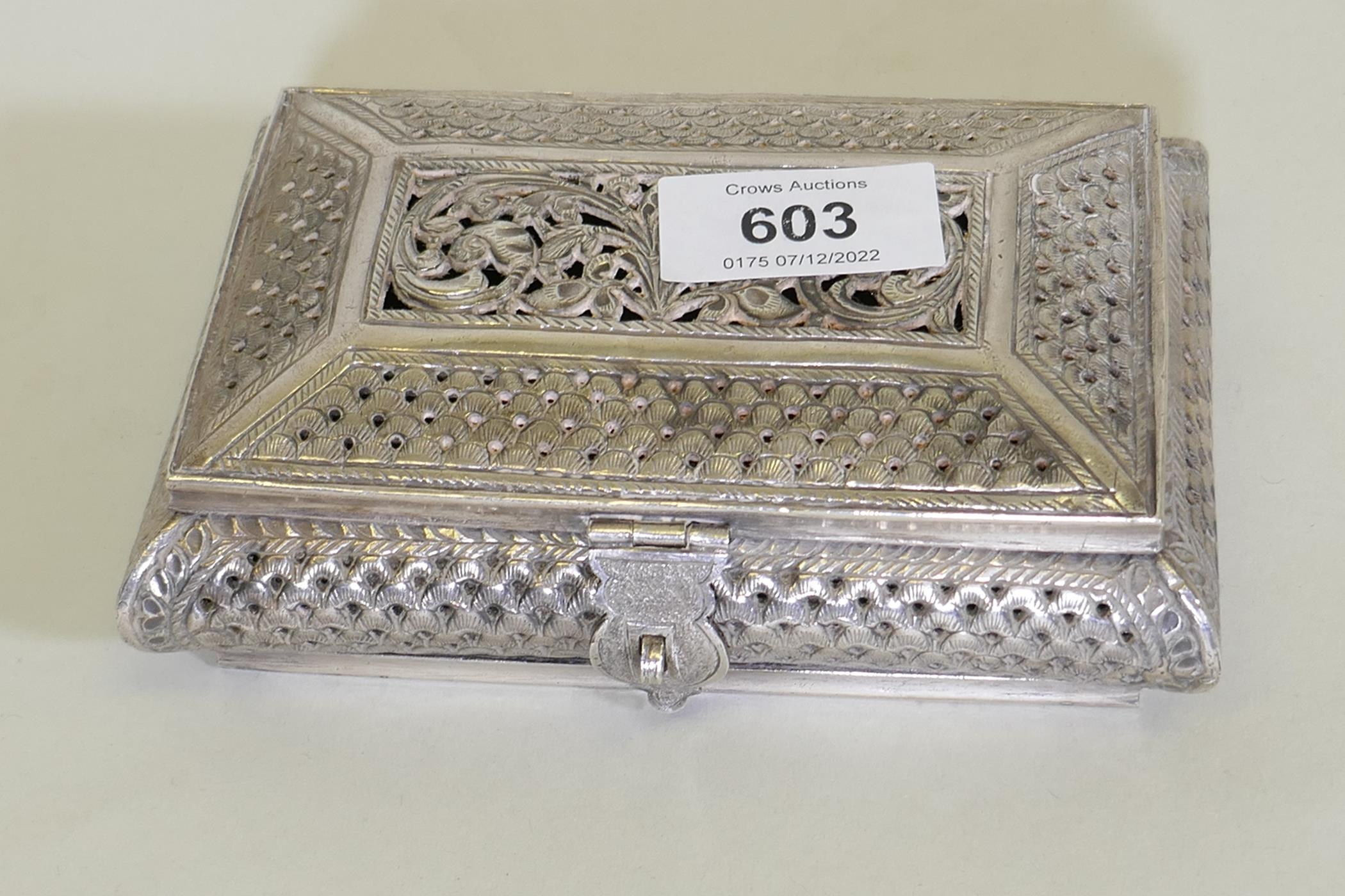 An oriental white metal cushion shaped box with engraved and pierced decoration, marked 'silver' - Image 2 of 5