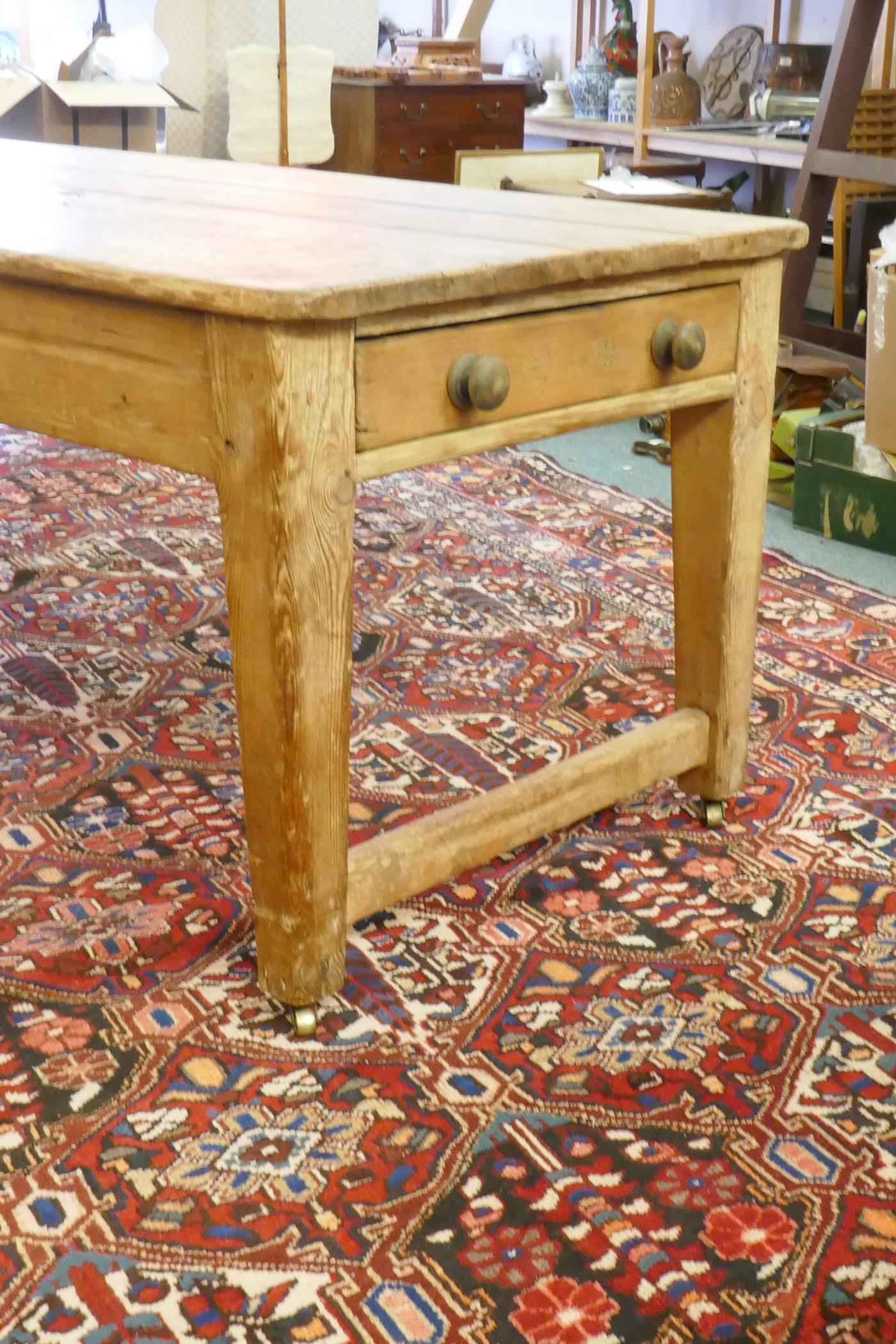 A large Victorian pine scullery table with plank top and end drawers, raised on square tapering - Image 3 of 6