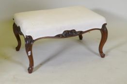 A Victorian rosewood foot stool, upholstered in a linen cover with an embroidered monogram, the