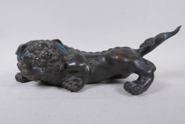 A Japanese Meiji filled bronze model of a kylin signed with seal mark, 38cm long
