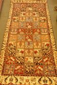 An antique Persian Bakhtiar full pile village rug with unique panel design, 300 x 130cm