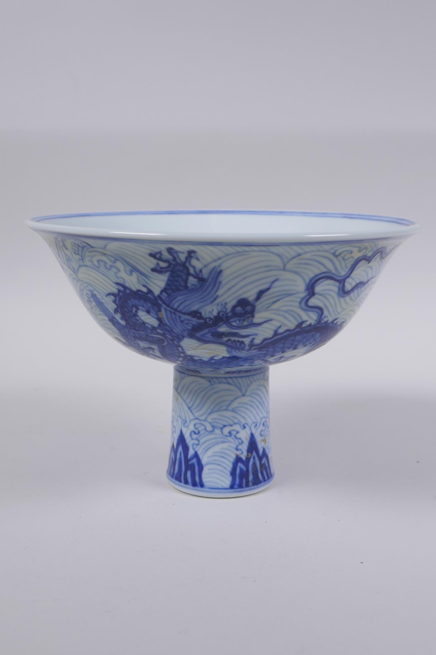 A blue and white porcelain stem bowl with dragon decoration, Chinese Xuande 6 character mark to