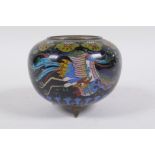 An antique Chinese black ground cloisonne censer decorated with a phoenix, butterflies and