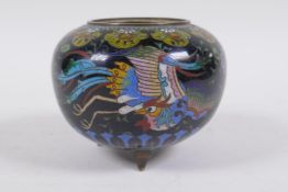 An antique Chinese black ground cloisonne censer decorated with a phoenix, butterflies and