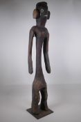 A naive African carved wood tribal figure, 92cm high, AF