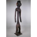 A naive African carved wood tribal figure, 92cm high, AF