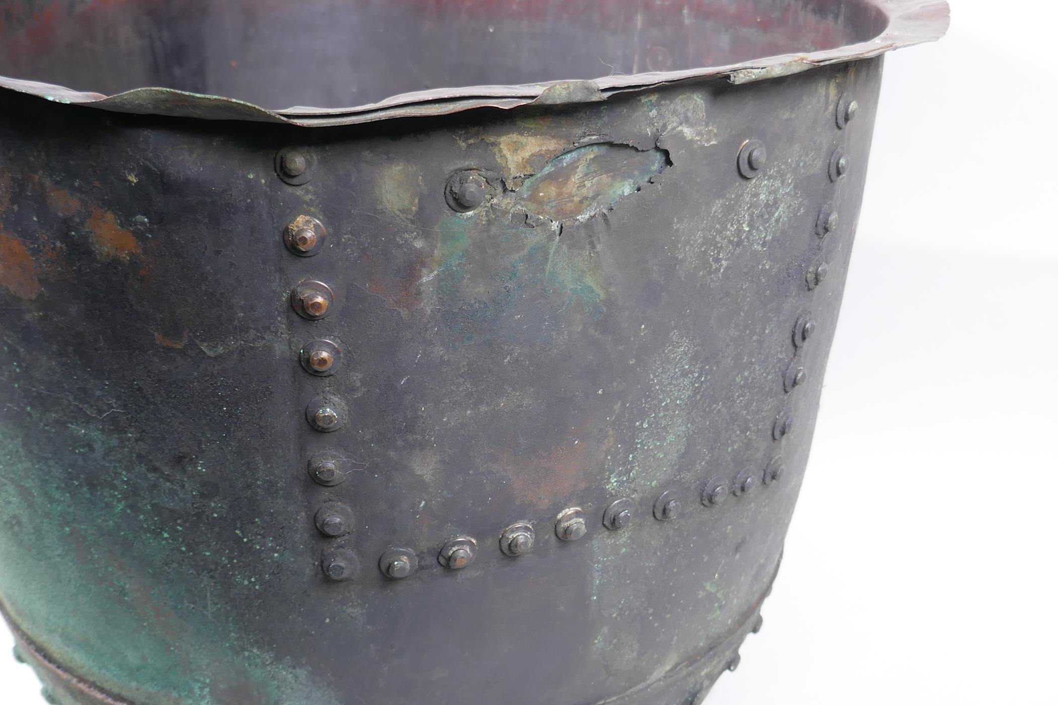 An antique riveted copper bin, with historic repair, 36cm high, 50cm diameter - Image 4 of 5