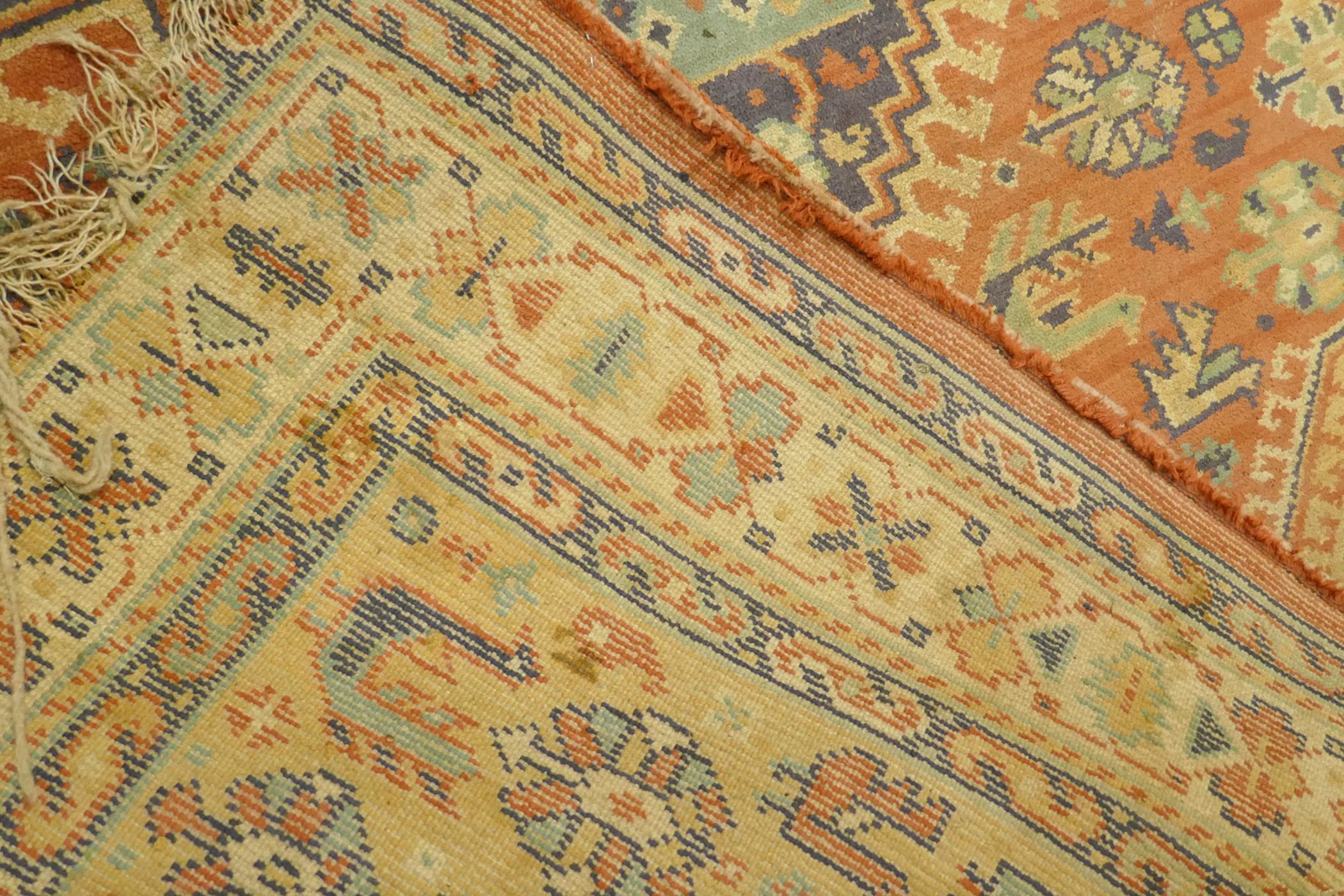 A Middle Eastern wool carpet with medallion design on a faded terracotta field, 160 x 110cm - Image 5 of 5