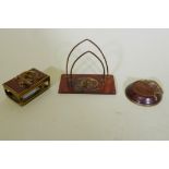 An antique faux tortoiseshell desk set with gilt metal mounts and salamander decoration, letter rack