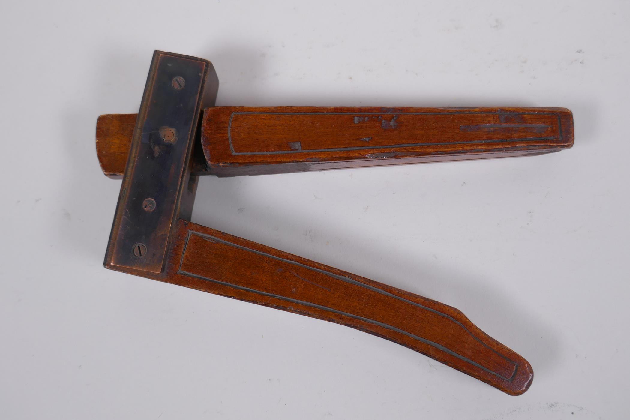 An antique walnut nut cracker with copper plates, inscribed, 19cm long - Image 2 of 5