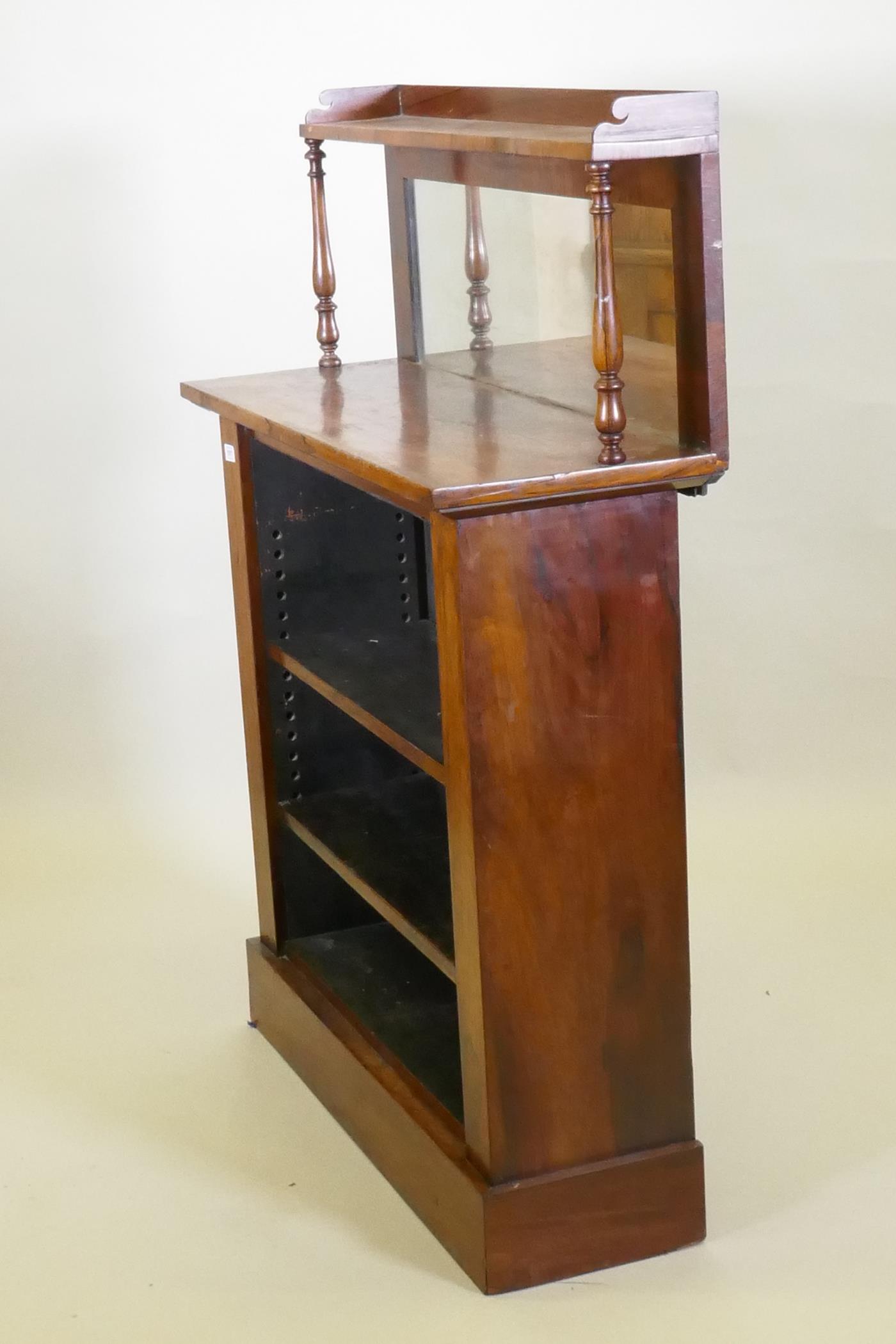 A C19th rosewood open bookcase, with mirror back and upper shelf with gallery, raised on a plinth - Image 3 of 3