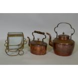 A Victorian copper kettle, 28cm high, and another smaller, and a brass casket with bevelled glass