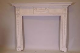 An Adam style carved and painted pine fire surround, 155cm wide, 132cm high