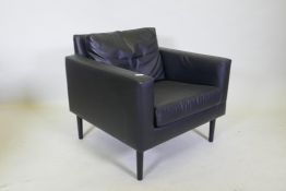 A contemporary Ikea easy chair, upholstered in black leather