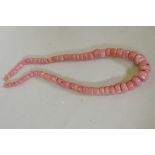 A graduated coral bead necklace, largest bead 2 x 2.5cm