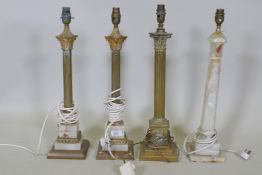 A pair of brass and onyx Corinthian column table lamps, a brass table lamp and an onyx table lamp,