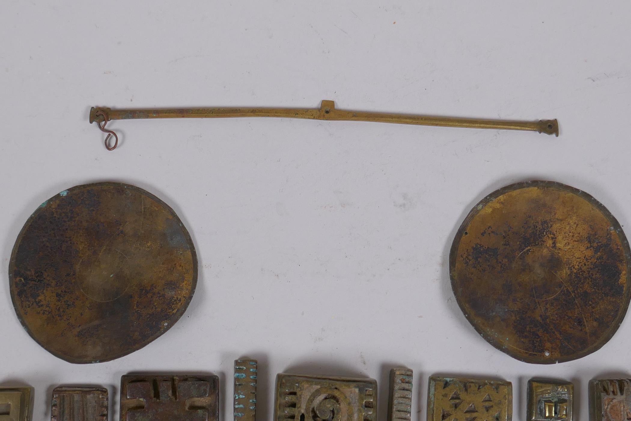 A collection of African bronze Ashanti gold weights with unique design, and a set of gold scales, AF - Image 7 of 7