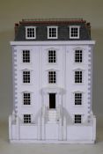 A large Georgian town house dolls' house, requires finishing, 90 x 64cm, 126cm high