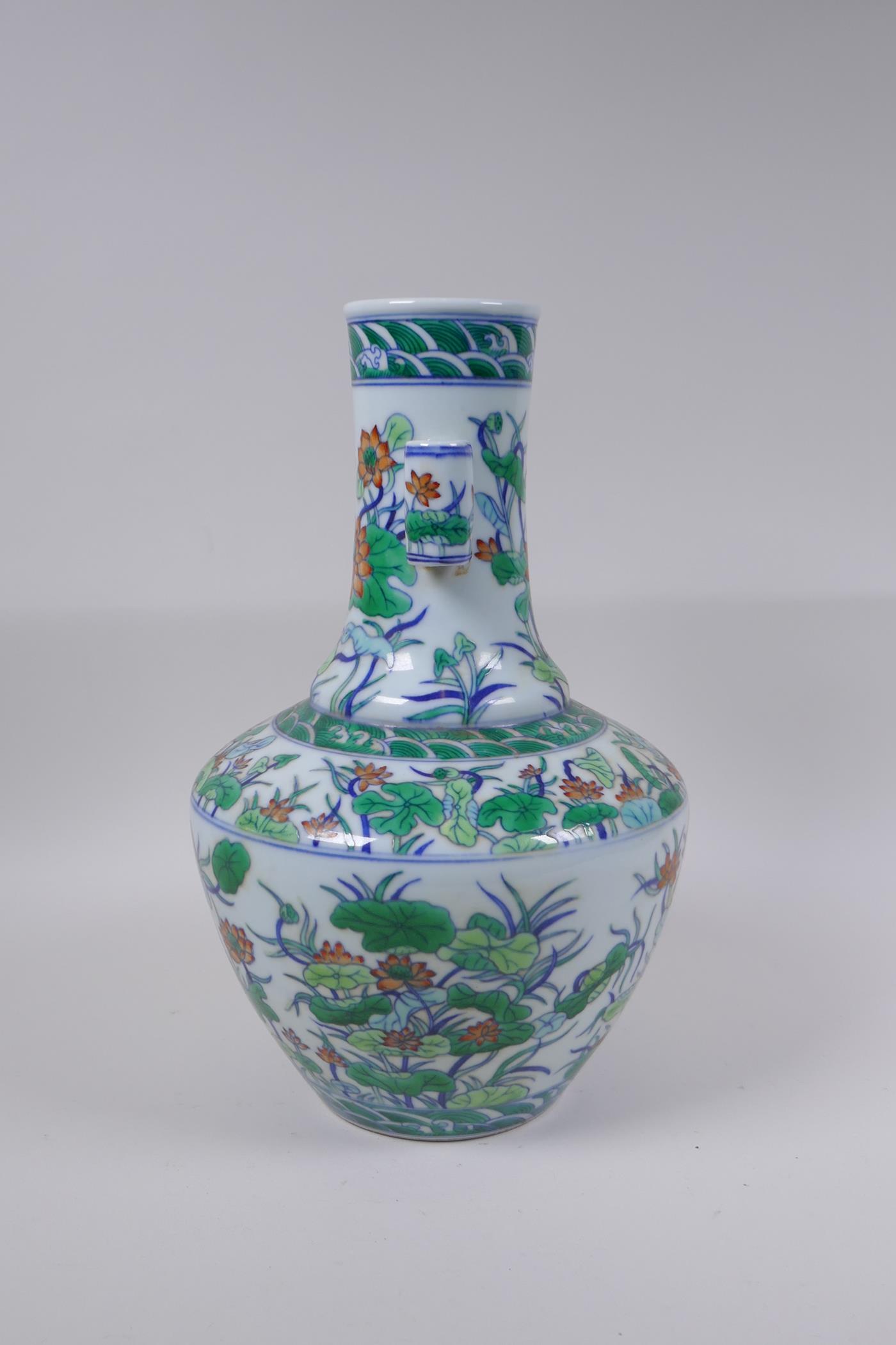A doucai porcelain vase with two lug handles and lotus flower decoration, Chinese Qianlong seal mark - Image 4 of 5