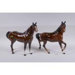 A Beswick horse and another similar Royal Doulton horse, 26cm long