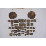A collection of African bronze Ashanti gold weights with unique design, and a set of gold scales, AF