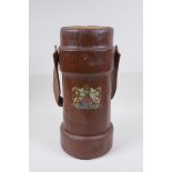 A vintage leather and painted canvas shell case decorated with the Royal Coat of Arms, 34cm high