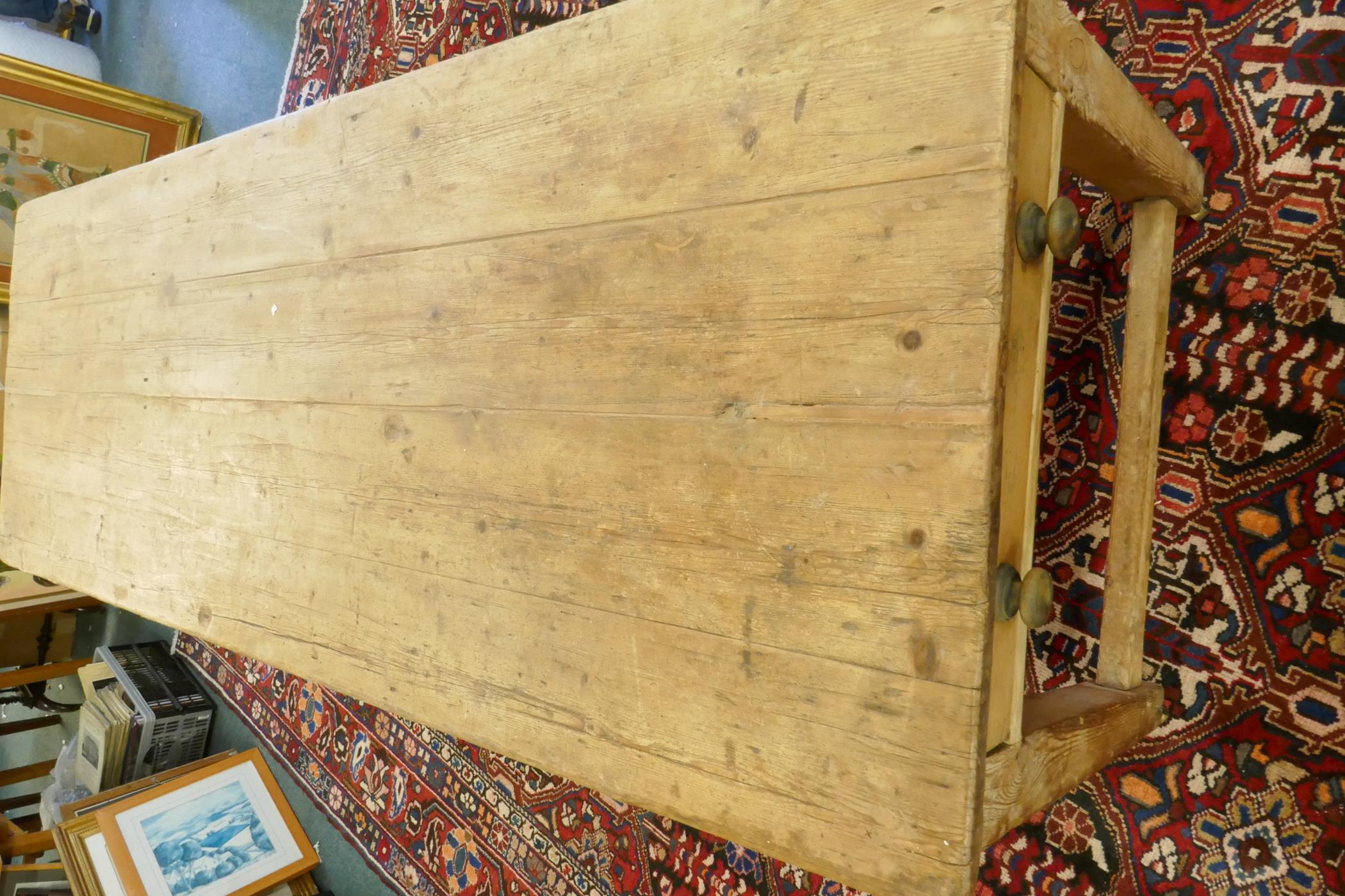 A large Victorian pine scullery table with plank top and end drawers, raised on square tapering - Image 4 of 6