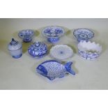 A collection of oriental porcelain with blue and white decoration, including footed bowls, jars