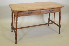 An Arts and Crafts oak side table in the manner of Heals, the two drawers with scratch moulded