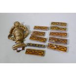 An antique giltwood mount, 36cm long, and a quantity of wall tiles