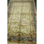 A Kashmir bamboo silk carpet with tree of life design on an ivory field, 300 x 190cm