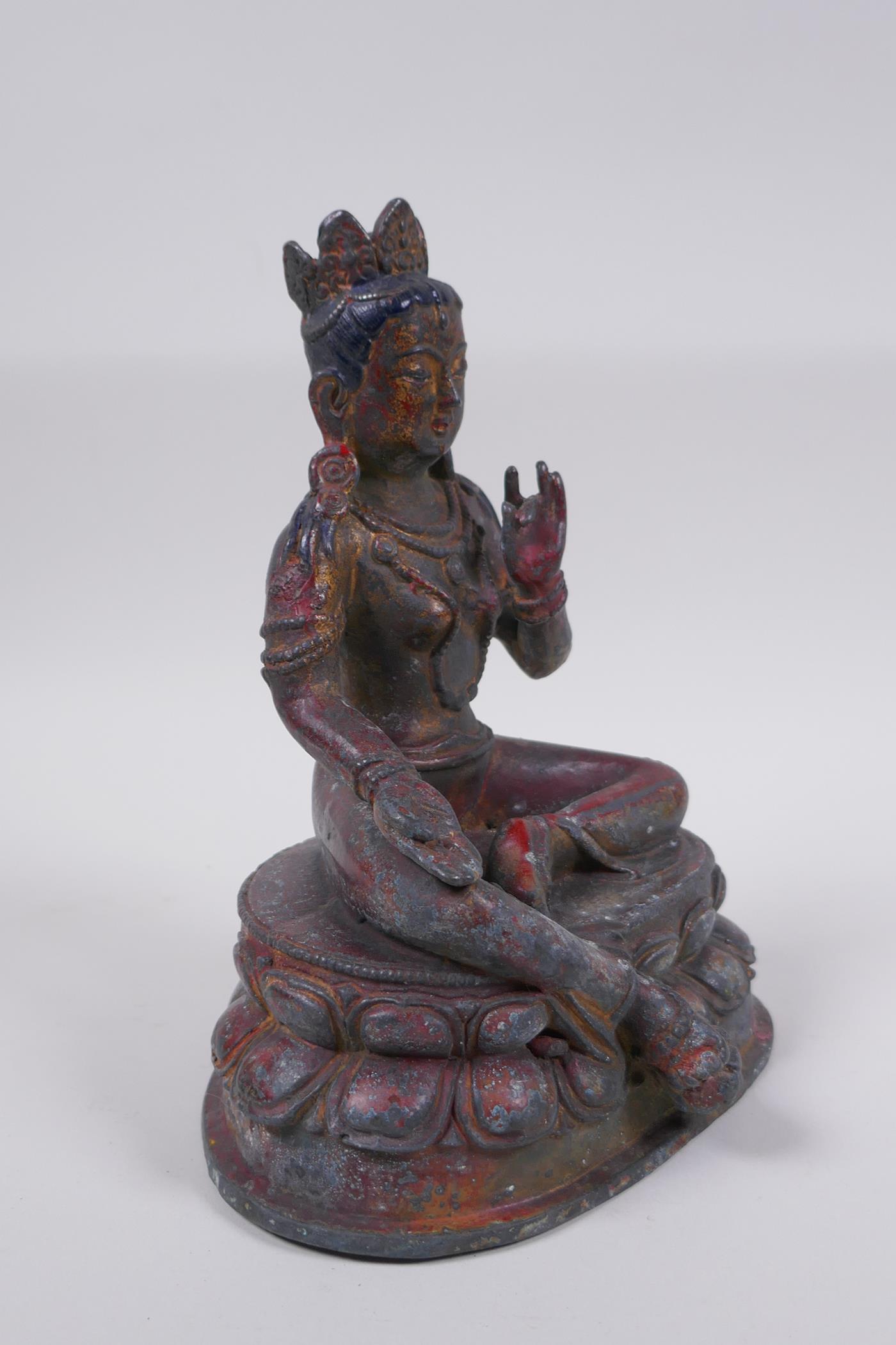 A Sino Tibetan bronze figure of a female deity with the remnants of gilt patina, 20cm high - Image 3 of 6