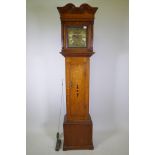 An oak longcase clock with C18th 30hour movement striking on a bell, the chapter ring inscribed