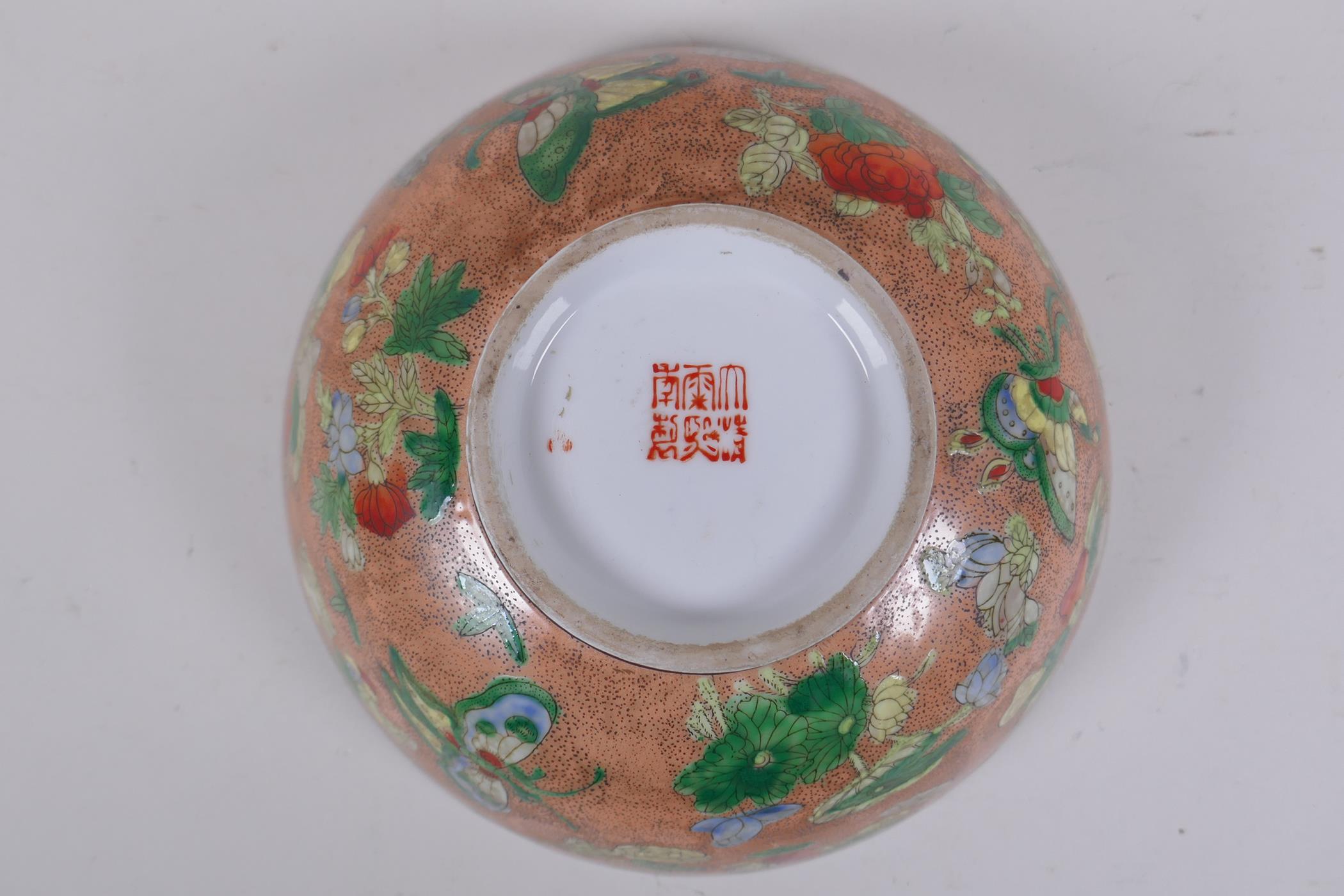 A Chinese peach ground porcelain bowl with famille verte enamel decoration of butterflies, flowers - Image 5 of 6