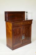 A Regency mahogany chiffonier with upper shelf raised on turned supports, single frieze drawer