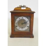 A mahogany case mantel clock with brass dial and silvered chapter ring, the Eight Day spring