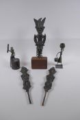 Three African benin bronze idols, one mounted, and two other benin bronzes of a water carrier and